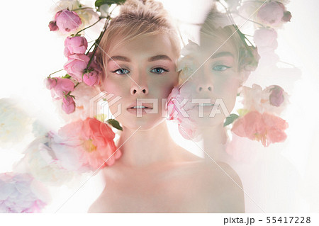 Young beautiful woman with bouquet of roses. Young beautiful woman with bouquet of roses. 55417228