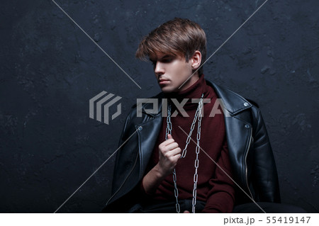 A young attractive man in a leather jacket  55419147