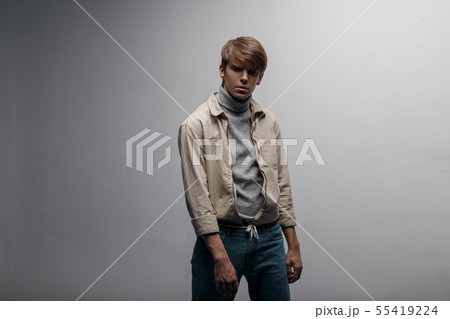 Young man in a bright light stylish jacket 55419224