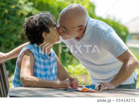 happy senior couple in the garden 55419271