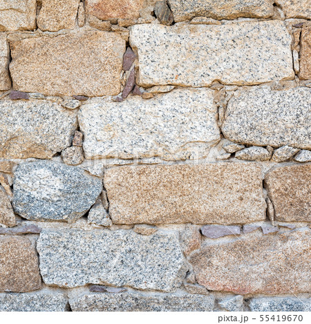 Texture of an irregular stone wall. Background. Texture of an irregular stone wall. Background. 55419670