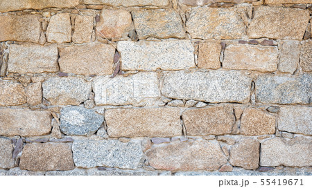Texture of an irregular stone wall. Background. 55419671