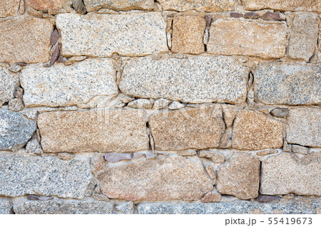 Texture of an irregular stone wall. Background. Texture of an irregular stone wall. Background. 55419673