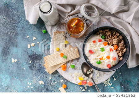 Muesli or Granola with candied fruit in a bowl 55421862