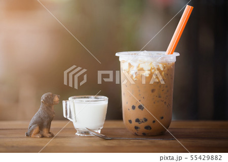 Ice bubble milk tea in takeaway glass. 55429882