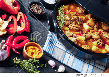 spicy chicken boneless thighs curry in a pan spicy chicken boneless thighs curry in a pan 55430450