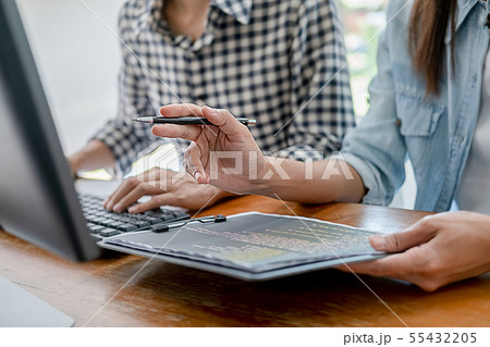 Programmer working in a software development and Programmer working in a software development and 55432205