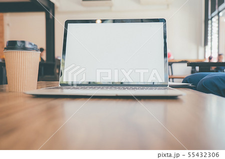 A laptop is placed on table with blank screen 55432306