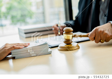 Lawyer businessman in suit hides money. A bribe in 55432725