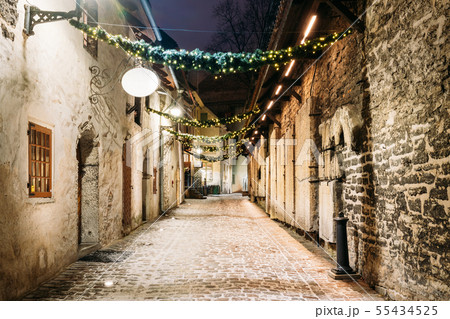Tallinn, Estonia, Europe. St. Catherine's Passage At Winter Evening In Night Illuminations. Narrow Tallinn, Estonia, Europe. St. Catherine's Passage At Winter Evening In Night Illuminations. Narrow 55434525