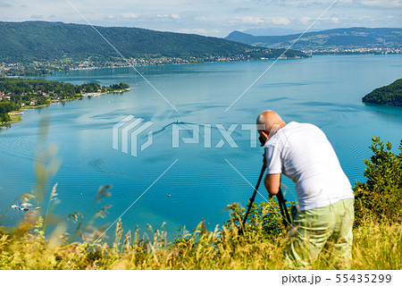 photographer taking a picture at Annecy lake, 55435299