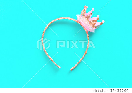 Pink and gold princess crown headband on blue 55437290