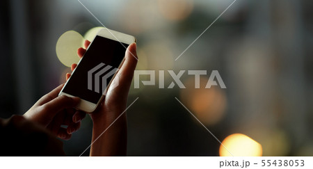 Female's hands holding mobile smartphone Female's hands holding mobile smartphone 55438053