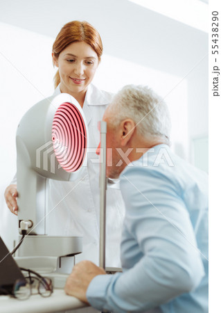 Grey-haired aged man visiting eye specialist every year Grey-haired aged man visiting eye specialist every year 55438290