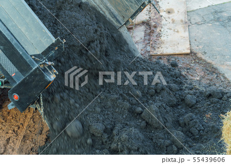 Earthworks with truck dumping and tipping raw 55439606
