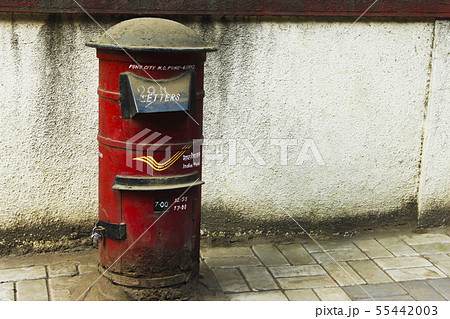 Close view of red Indian post box on street. Close view of red Indian post box on street. 55442003