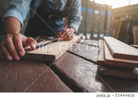 Carpenter working with equipment on wooden table Carpenter working with equipment on wooden table 55444916