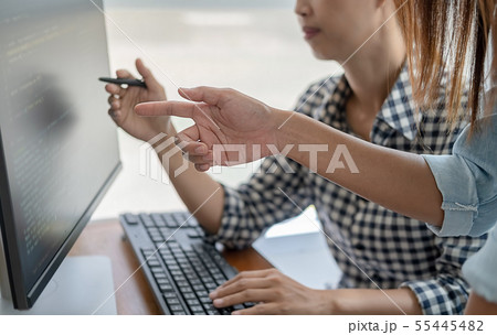 Programmer working in a software development and Programmer working in a software development and 55445482