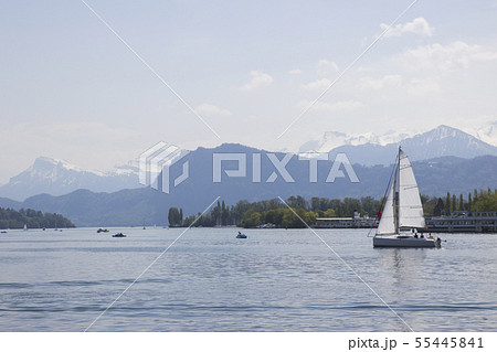 Ship in front of snow covered Alps mountains 55445841