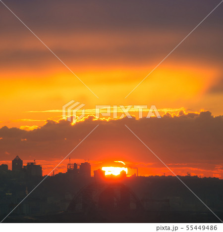 Sunset in the city with silhouette of buildings Sunset in the city with silhouette of buildings 55449486
