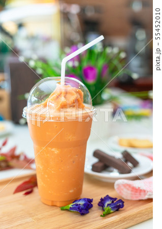 Milk tea or Thai milk tea on the wooden plate. 55452010