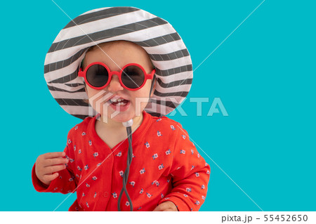 Child in sunglasses and hat Child in sunglasses and hat 55452650