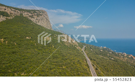 Crimean roads: aerial view of curvy mountain road in summer day 55452823