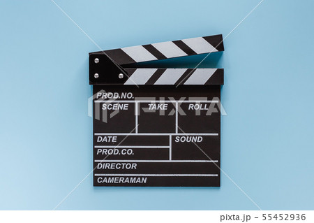 Movie clapper board on blue background Movie clapper board on blue background 55452936