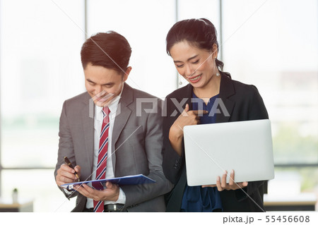 Asian business people sitting in office.. Asian business people sitting in office.. 55456608