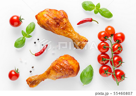 healthy grilled chicken legs with fresh tomato 55460807