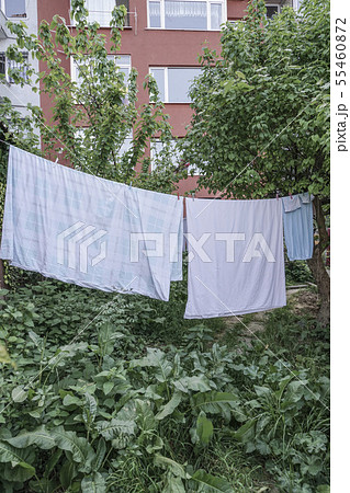 hanged clothes at garden of an building hanged clothes at garden of an building 55460872