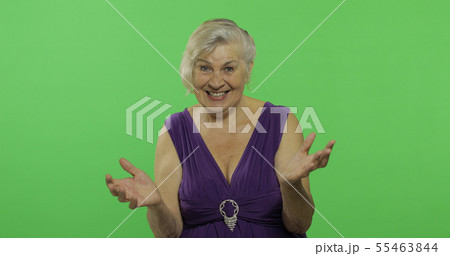 An elderly woman shows amazement, joy and smiles. Old grandmother. Chroma key An elderly woman shows amazement, joy and smiles. Old grandmother. Chroma key 55463844