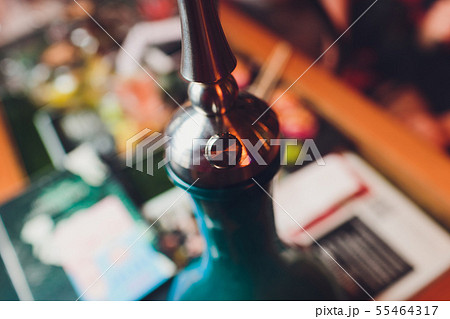 Part of a hookah in the arabic restaurant. 55464317