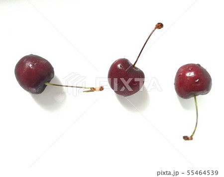 Three red cherry fruits isolated on white  55464539