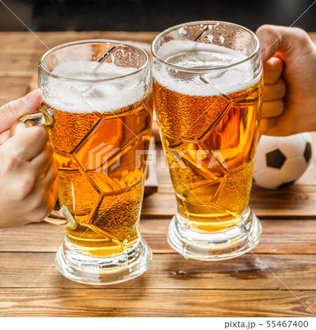 Appetizers and beer on the table for watch the football match. 55467400