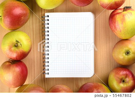 Squared paper notebook on wooden table top view. Squared paper notebook on wooden table top view. 55467802