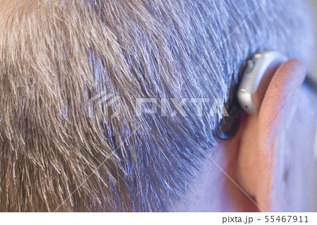 Man with hearing aid 55467911
