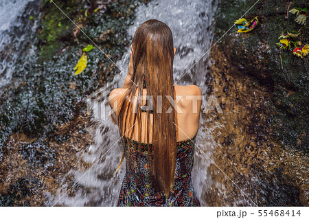 Young woman tourist in Holy springs Sebatu in Bali Young woman tourist in Holy springs Sebatu in Bali 55468414