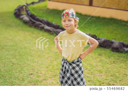 Boy tourist in sarong, national Balinese clothing Boy tourist in sarong, national Balinese clothing 55469682