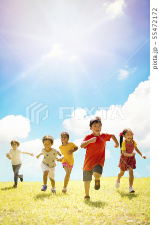 Multi-ethnic group of school children laughing and 55472172