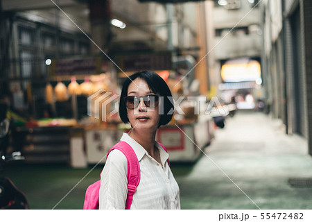 Asian woman walk in the traditional marketplace 55472482