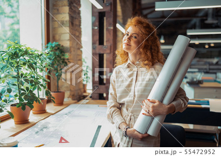 Beautiful interior designer feeling excited before starting project Beautiful interior designer feeling excited before starting project 55472952