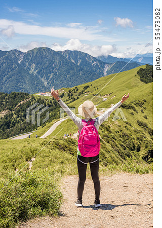mountain climbing woman stretch and feel free mountain climbing woman stretch and feel free 55473082