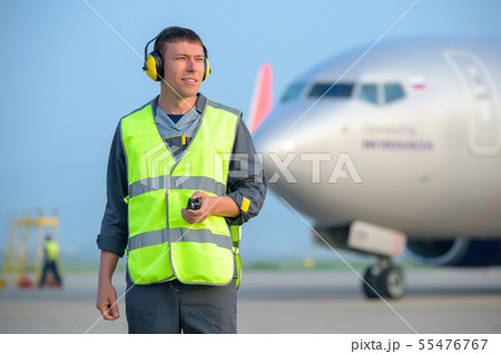 airport worker man male maintenance aircraft airplane airport worker man male maintenance aircraft airplane 55476767