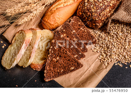 Fresh fragrant bread with grains and cones  55476950