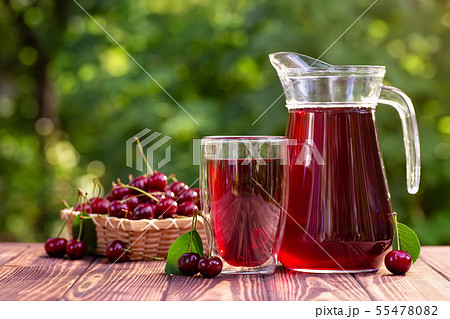 cherry juice in glass and jug 55478082