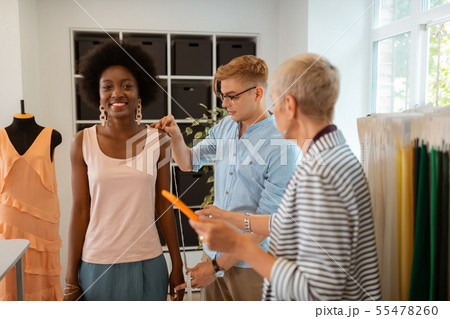 Smiling attractive young girl standing in a workshop 55478260