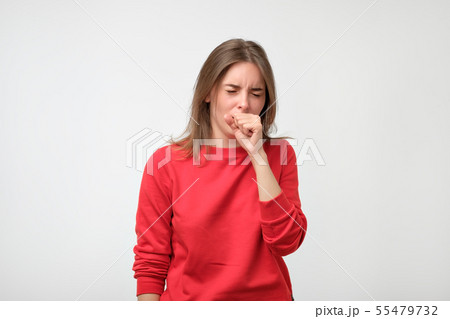 unhappy caucasian woman in red pulover suffering unhappy caucasian woman in red pulover suffering 55479732
