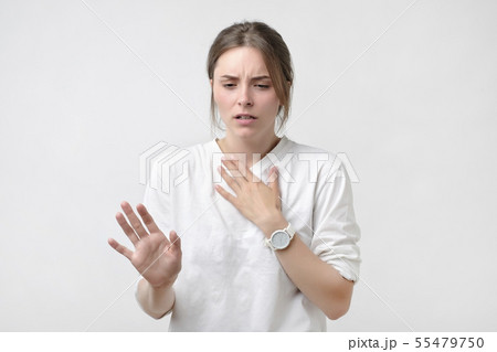 European woman in white t-shirt having a sore 55479750