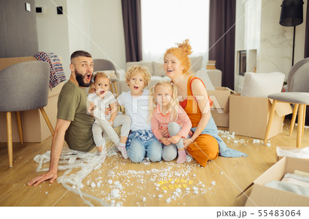 Positive delighted family moving to a new house Positive delighted family moving to a new house 55483064